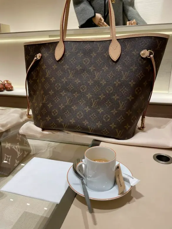 Neverfull with coffee Instagram post